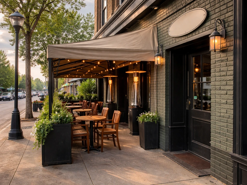 Covered patio entrance on Whyte Ave in Edmonton with heaters and a building address plate area, no people.